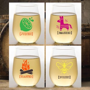 May include: Four clear wine glasses with different designs and text. The glasses are filled with a clear liquid. The designs include a lime with a juice drop, a pinata, a campfire, and a bee. The text on the glasses reads "[JUICED]" , "[SMASHED]" , "[TOASTED]" , and "[BUZZED]" .