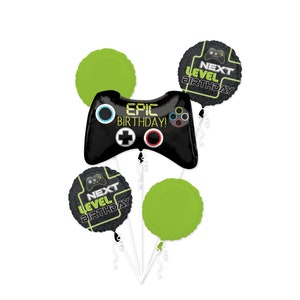 May include: A set of five balloons for a birthday party. The balloons are black, green, and have a video game theme. One balloon is shaped like a video game controller and says "Epic Birthday!" The other four balloons are round and say "Next Level Birthday!"