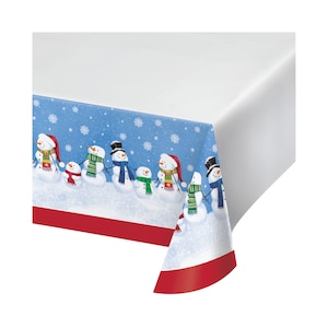 May include: A blue and white plastic tablecloth with a red border features a line of snowmen holding hands. The snowmen are wearing scarves and hats. The background is a light blue with white snowflakes.