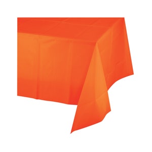 May include: A bright orange plastic tablecloth. This tablecloth is perfect for parties and events.