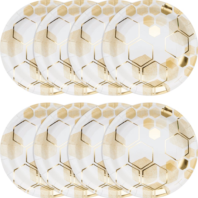 May include: Set of 12 white paper plates with a gold honeycomb pattern. The plates are perfect for a party or special occasion.