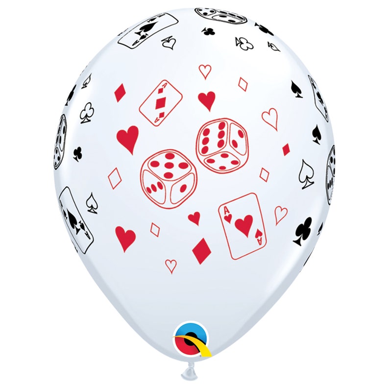 May include: A clear balloon with a casino theme. The balloon is decorated with red and black playing card suits, dice, and playing cards. The balloon is inflated and ready for a party or event.