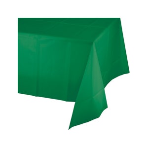 May include: A solid green plastic tablecloth. The tablecloth is rectangular and has a smooth, shiny surface.