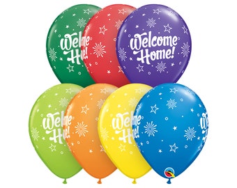 May include: A set of six colorful balloons with a white star and firework pattern. The balloons have the text "Welcome Home!" printed on them.