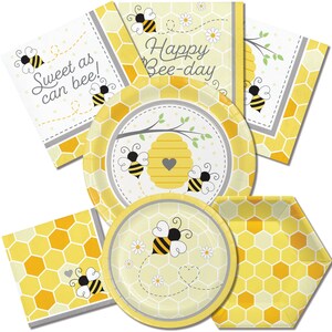 May include: A set of yellow and gray bee-themed party supplies, including plates, napkins, and a banner that reads "Happy Bee-day".