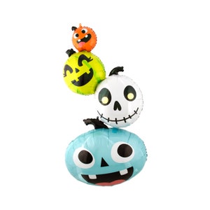 May include: Three Halloween-themed foil balloons in the shape of pumpkins. The top balloon is orange with a jack-o'-lantern face. The middle balloon is green with a jack-o'-lantern face. The bottom balloon is blue with a smiling face.