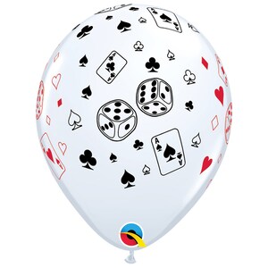 May include: A clear balloon with a casino theme. The balloon is covered with black and red playing card suits, dice, and playing cards. The balloon is inflated and ready for a party.