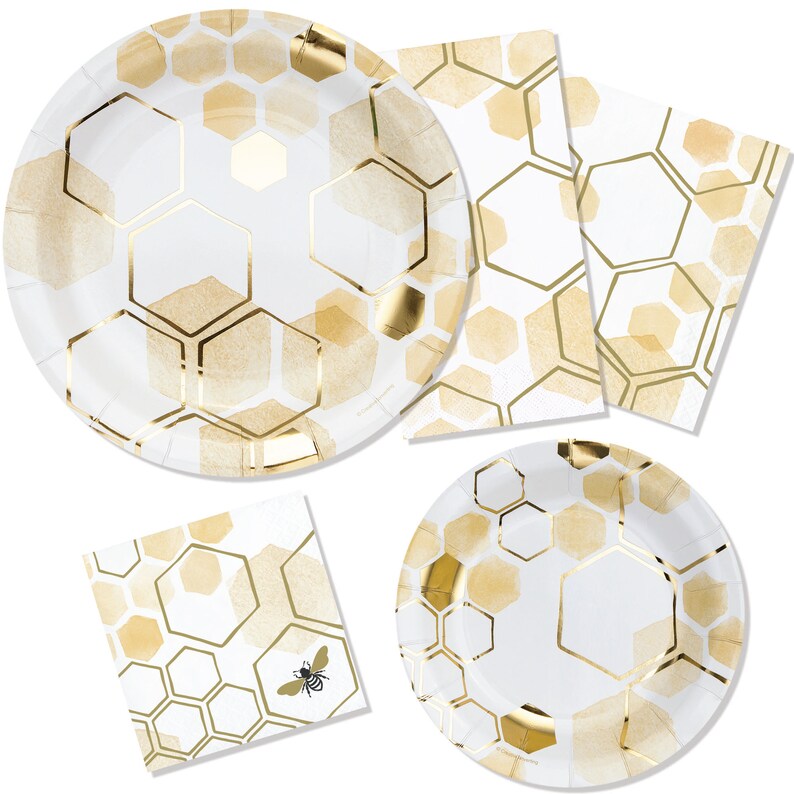 May include: A set of white paper plates and napkins with a gold honeycomb pattern. The napkins feature a small bee illustration.