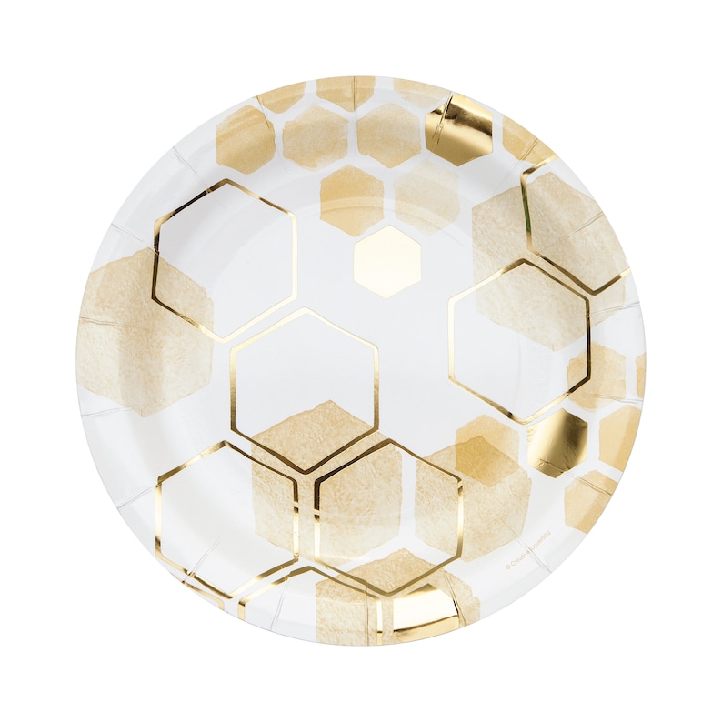May include: White paper party plates with a gold honeycomb pattern.