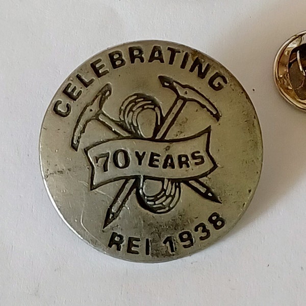 REI Celebrating 70 Years 1938 Pewter Tone Lapel Hat Tie Pin Souvenir 1973