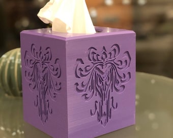 May include: Purple tissue box cover with a decorative design. The design is a stylized floral pattern with a gothic feel.