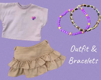 Completo da 18" con top viola, gonna con volant color marrone chiaro a forma di cuore iridescente e 2 braccialetti, adatto per bambole American Girl, Our Generation, Maplelea