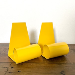 1960’s Pop Art MCM Coiled Steel  “Bookworm” Bookends Primary Yellow Enamel from Design Centre London England