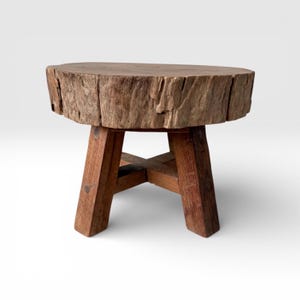 May include: A set of three ceramic mugs with a speckled, matte finish. The mugs are in shades of cream, light gray, and dark gray. Each mug has a simple, minimalist design, perfect for coffee or tea.