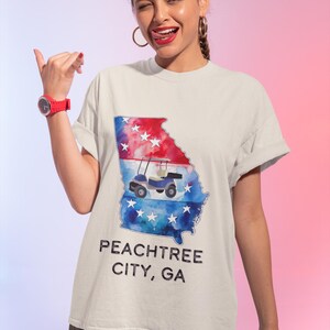 ピーチツリー・シティ コンフォートカラーズTシャツ、ゴルフカート・シティ ユニセックスTシャツ、独立記念日シャツ、ザ・バブルGATシャツ、ピーチツリー・シティ ピーチTシャツ