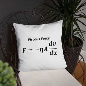 May include: A square white scatter cushion featuring the black printed text Viscous Force and the physics equation F = -ηA dv/dx centred on the front. The cushion has a smooth fabric surface and is displayed as a decorative item for home seating.