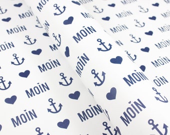 May include: White wrapping paper with a repeating pattern of blue anchors, hearts, and the word "MOIN".