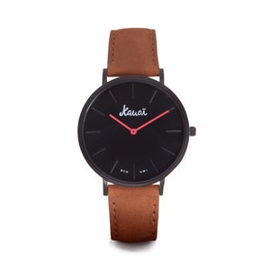 Men&#39;s watch with black dial and brown leather strap. Basic, minimalist, flat and modern, with red needles.