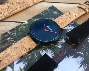 Vegan men's black watch. Flat, stainless steel, with recycled cork strap and red needles.