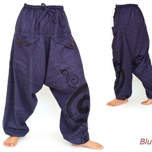 May include: Blue cotton pants with a drawstring waist and two pockets. The pants have a black and white swirl design on the legs. The word "Blue" is written in red at the bottom of the image.