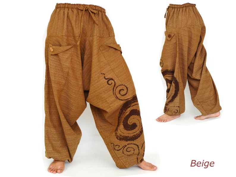 May include: Beige harem pants with a brown swirl design. The pants have a drawstring waist and two pockets.