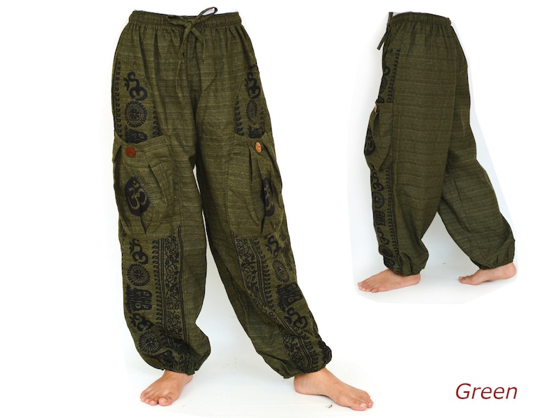 May include: Green cotton pants with black Om symbol and other designs printed on the sides. The pants have a drawstring waist and two large pockets.