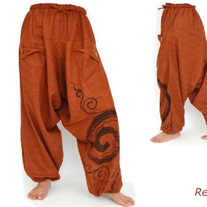 May include: Red, loose-fitting pants with a swirling pattern. The pants have a drawstring waist and pockets.