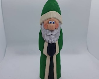 Hand carved and hand painted green Santa