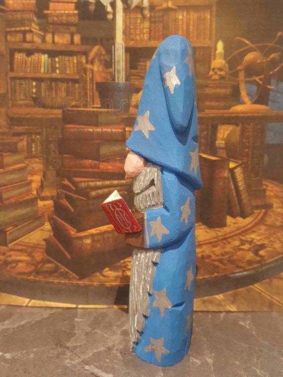 Hand carved and hand painted wooden wizard with spell book 