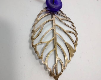 Bronze Leaf Pendant Necklace: Blue Glass Bead, Black Leather Cord