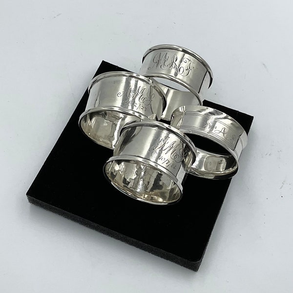 Set of Four Antique Sterling Silver Napkin Rings: Unique Engravings and Rich History