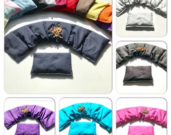 May include: A set of 10 neck pillows in various colors, including pink, blue, red, yellow, and green. Each pillow is filled with small beads and has a curved shape to fit the neck.
