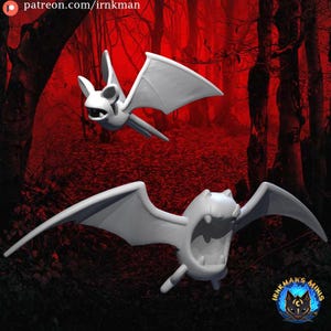 May include: Two white bat figurines with outstretched wings are shown against a dark red forest backdrop. The bats have open mouths and detailed facial features. The image includes the text "patreon.com/irnkman" and a logo.