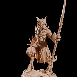 May include: A detailed, hand-painted miniature figurine of a horned, goat-like creature with a spear. The figure is painted in a light brown color and stands on a rocky base.