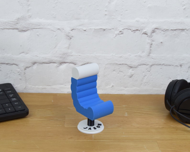 May include: A blue and white 3D printed chair with the name "Jason" printed on the base.