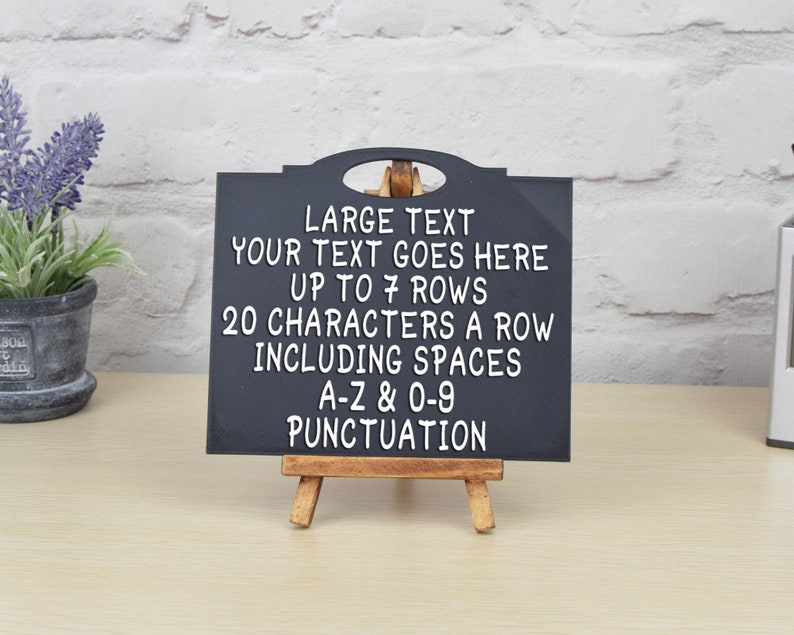 May include: Black chalkboard sign with a wooden easel stand. The sign has white text that reads "LARGE TEXT YOUR TEXT GOES HERE UP TO 7 ROWS 20 CHARACTERS A ROW INCLUDING SPACES A-Z & 0-9 PUNCTUATION".