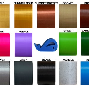 May include: A chart of 15 different colors of filament for 3D printing. The colors include gold, shimmer gold, shimmer copper, bronze, brown, pink, purple, green, dark green, silver, grey, black, marble, and blue.