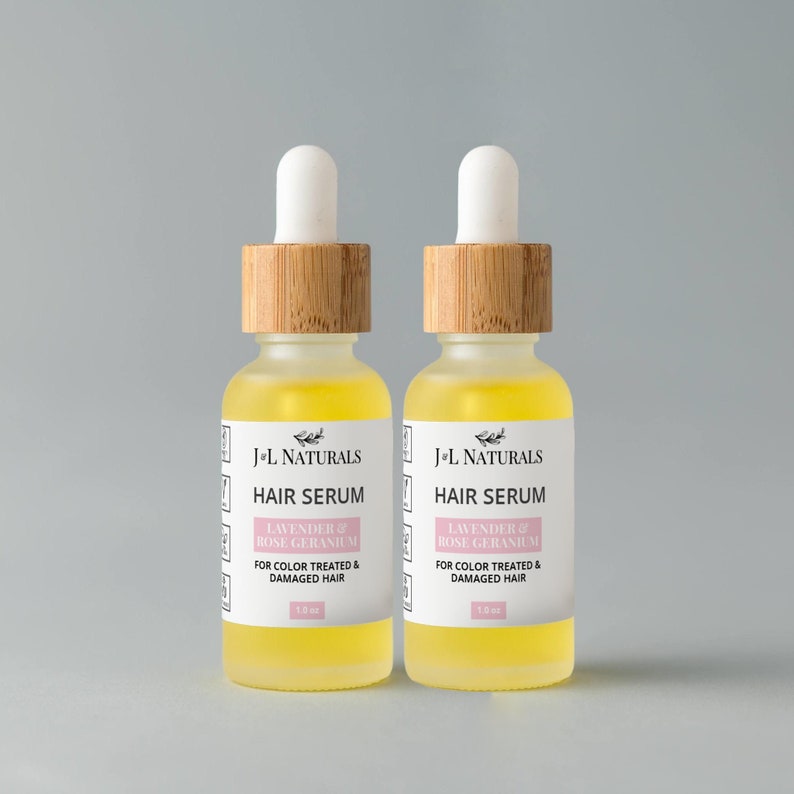 May include: Two amber glass bottles with bamboo lids and droppers filled with a yellow liquid. The bottles are labeled "J+L Naturals Hair Serum Lavender & Rose Geranium For Color Treated & Damaged Hair 1.0 oz."