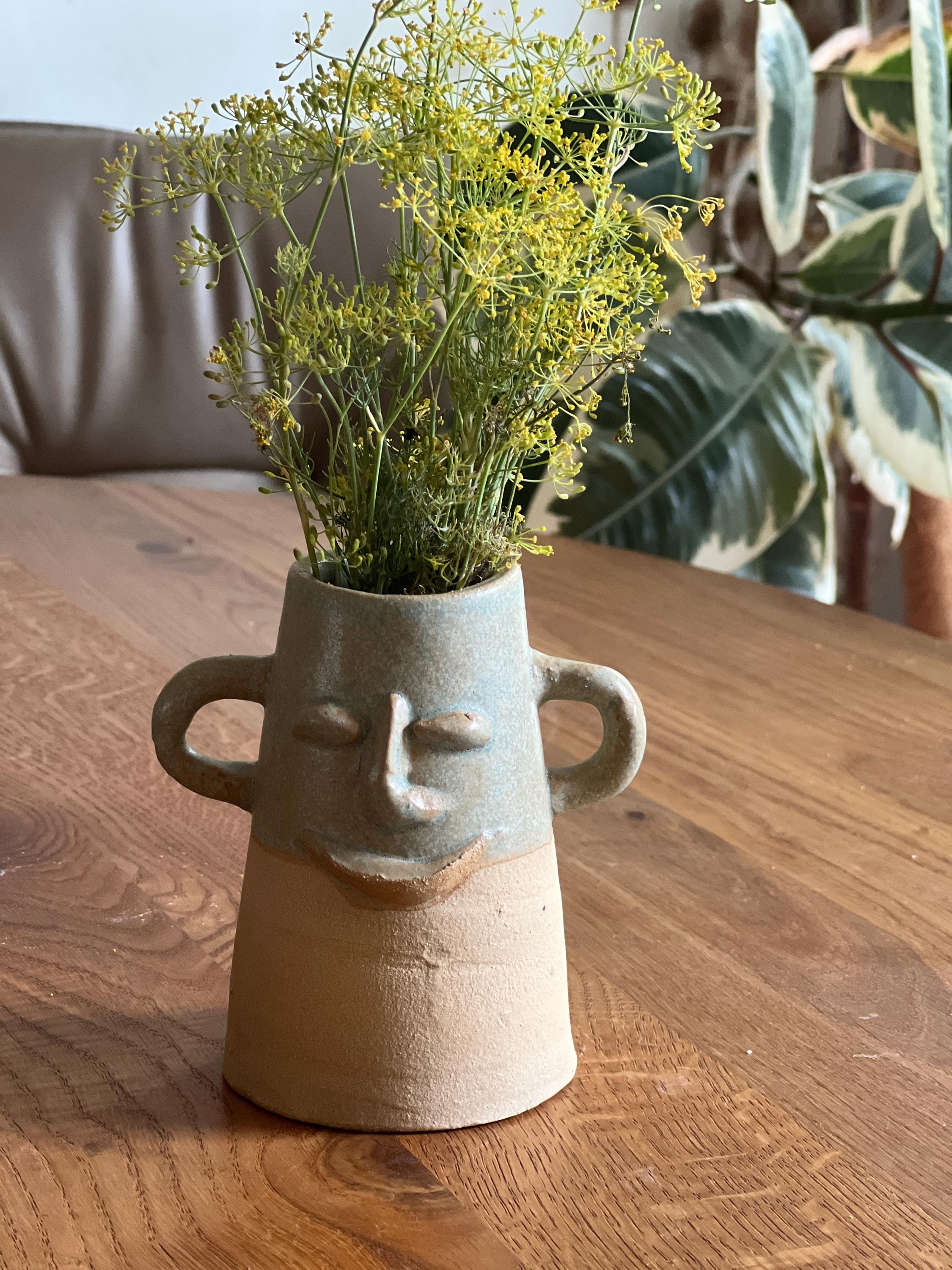 Vase mit gesicht