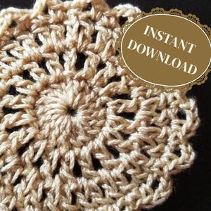 May include: A beige crocheted doily with a scalloped edge. The doily is round and has a delicate, intricate design. The text "INSTANT DOWNLOAD" is visible in the upper right corner of the image.