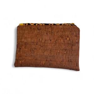 May include: A set of three ceramic mugs with a speckled, matte finish. The mugs are in shades of cream, light gray, and dark gray. Each mug has a simple, minimalist design and a rounded handle. The mugs are likely for coffee or tea.