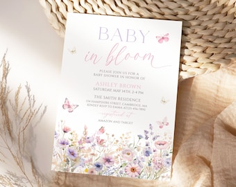 May include: A baby shower invitation with a floral design and the text "BABY in bloom". The invitation includes the date, time, and location of the shower, as well as the name of the guest of honor, Ashley Brown. The invitation also includes the text "Registered at Amazon and Target".