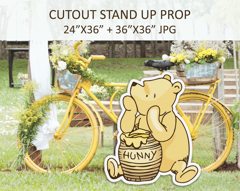 May include: A cutout stand-up prop featuring Winnie the Pooh holding a honey pot. The prop is 61 cm by 91 cm and 91 cm by 91 cm. The background shows a yellow bicycle with flowers in a basket.