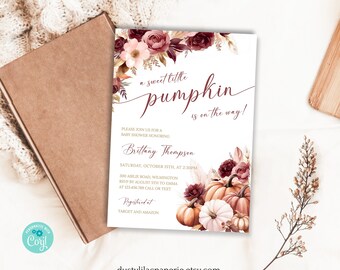 May include: A rectangular baby shower invitation card featuring burgundy and blush floral arrangements at the top and bottom corners, with pumpkins at the bottom. The text reads: a sweet little pumpkin is on the way! Brittany Thompson, Saturday, October 15th, at 2:30PM, 300 Airlie Road, Wilmington, RSVP by August 5th to Emma at 123.456.789 call or text, Registered at Target and Amazon.