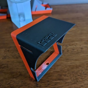 Customization is available and quite popular.  Here is a gray standard sized GoPro sunshade with the GoPro logo embossed in the top.