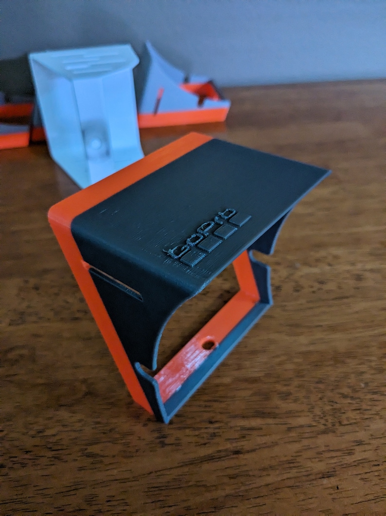 Customization is available and quite popular.  Here is a gray standard sized GoPro sunshade with the GoPro logo embossed in the top.