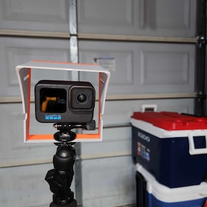 Here is a shot of the standard sized GoPro sunshade mounted on a kayak.  The shade keeps the camera 5 to 10 degrees cooler in bright sun and can prevent thermal shutdown of the camera.