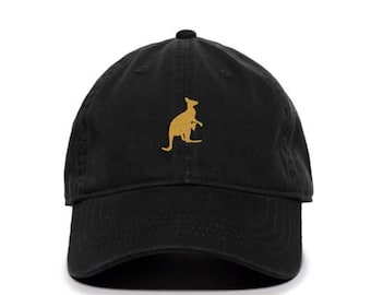 May include: A black baseball cap with a gold embroidered kangaroo silhouette.