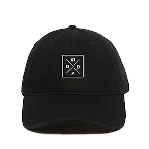 May include: Black baseball cap with a white logo that says "#1 D.A.D." in a square with a cross inside.