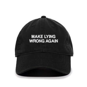 May include: Black baseball cap with white embroidered text that reads "Make Lying Wrong Again".